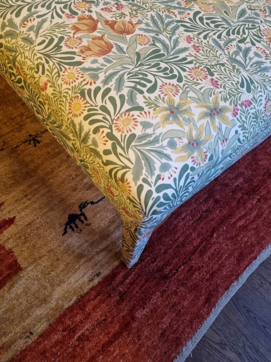 RETURNED PRODUCT An XL Ottoman with upholstered legs in Morris and Co