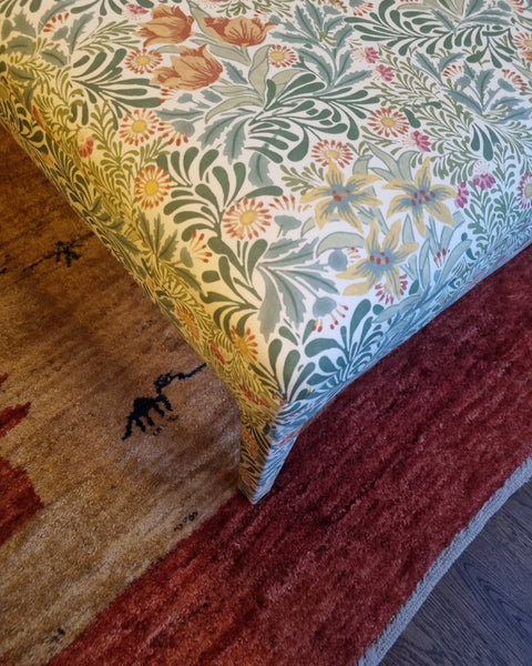 RETURNED PRODUCT An XL Ottoman with upholstered legs in Morris and Co