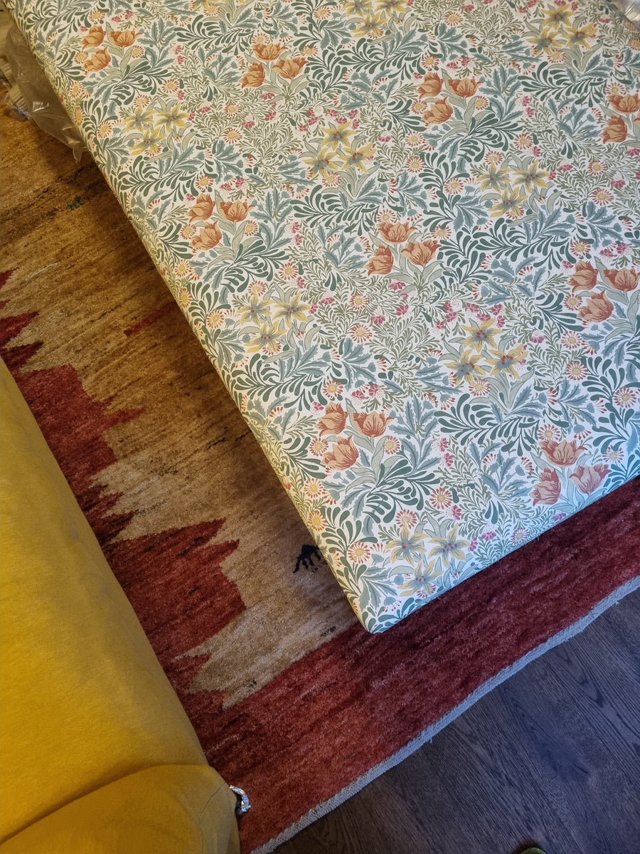 RETURNED PRODUCT An XL Ottoman with upholstered legs in Morris and Co