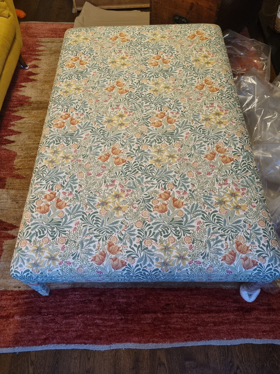 RETURNED PRODUCT An XL Ottoman with upholstered legs in Morris and Co
