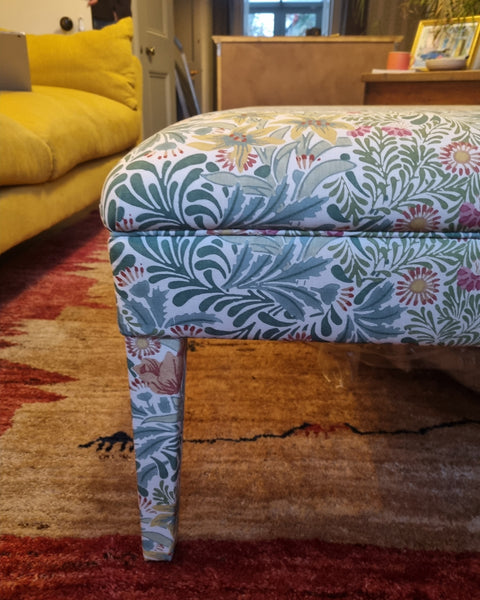 RETURNED PRODUCT An XL Ottoman with upholstered legs in Morris and Co