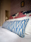 Our Volga Linen bolster cushion accessorising our guest room bed