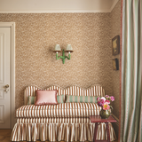 Banquette with wavy top, striped fabric and a ruffled skirt around the based. fixed back seating in hallway setting