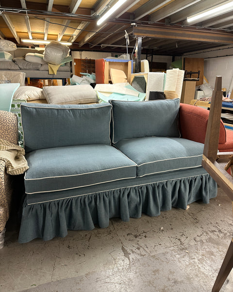 A skirted sofa ready to ship