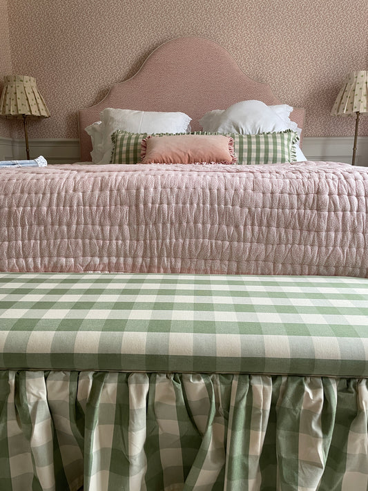 Our Cleo ottoman in Ina Mankin Green Gingham set against a beautiful pink bed