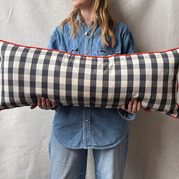 Bolster Cushion 90x35cm in Ian Mankin, suffolk checksmall in black with Bright red piping
