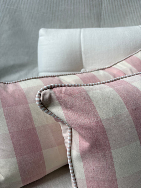 A pair of Mini bolster 60 x 30cm in Ian Mankin, suffolk check in pink with pink and white stripe piping