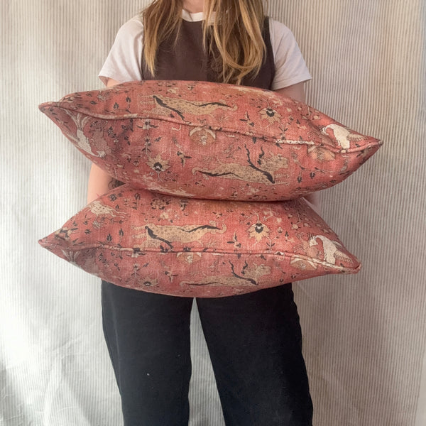 A pair of square cushions