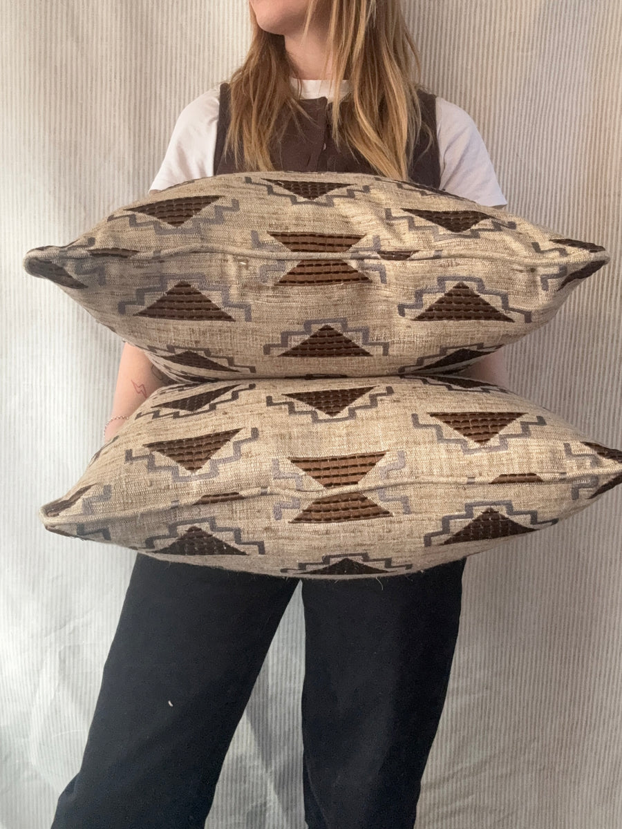A pair of square cushions in Noblis