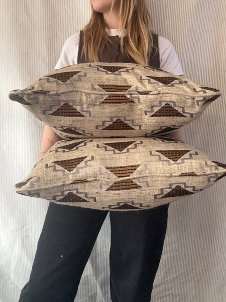 A pair of square cushions in Noblis