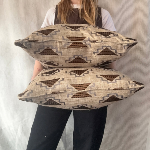 A pair of square cushions in Noblis