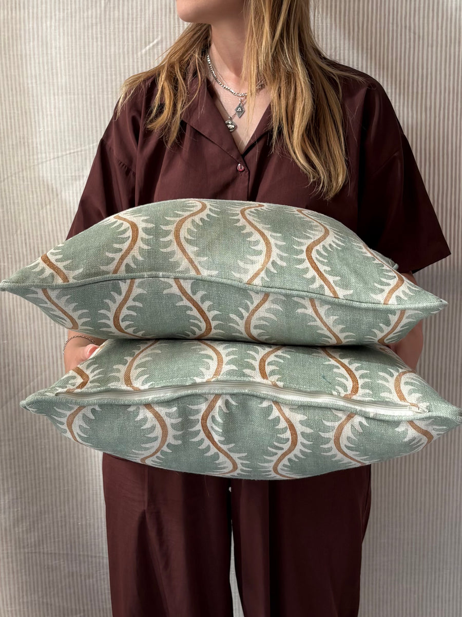 A pair of square cushions in Linwood Helter Skelter