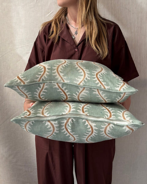A pair of square cushions in Linwood Helter Skelter