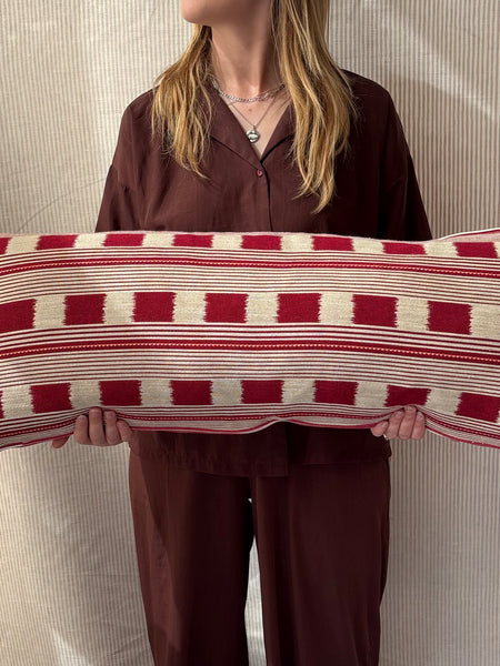 Bolster cushion 90 x 35cm in Christopher Farr, Lost and Found in ruby with Red stripe back and piping