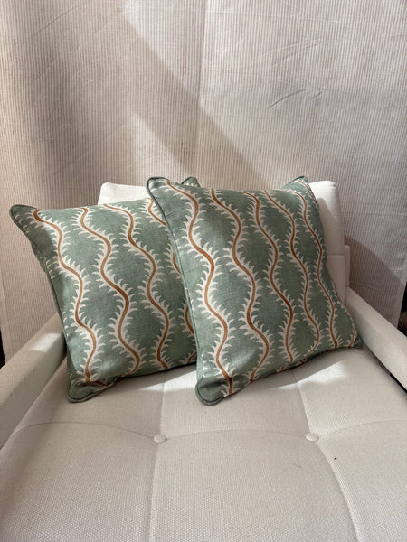 A pair of square cushions in Linwood Helter Skelter