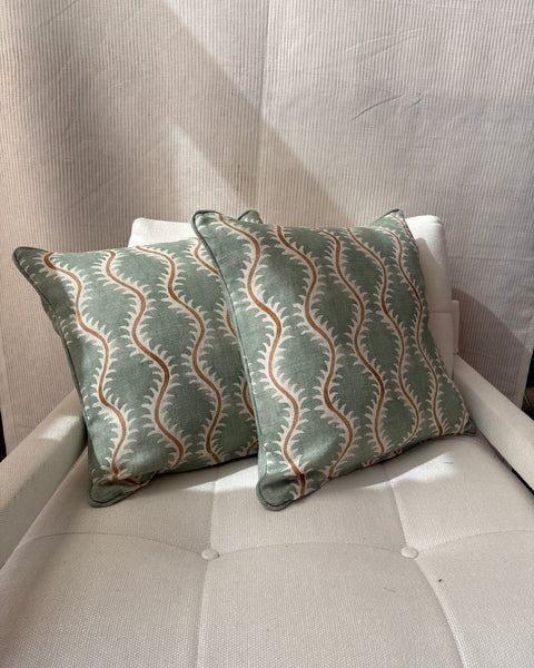 A pair of square cushions in Linwood Helter Skelter