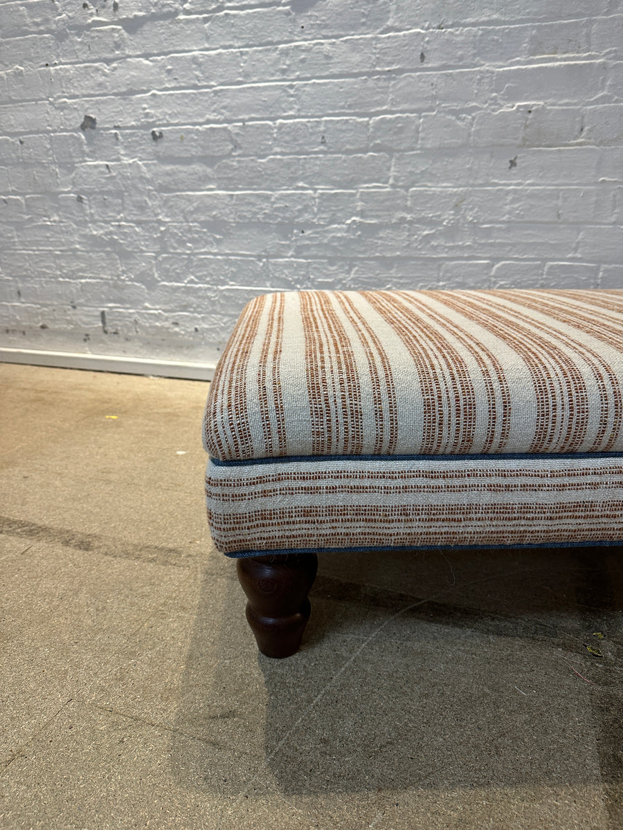Bryher ottoman in Christopher Farr Japura Coral in Blue piping