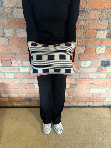 Lumbar cushion in Christopher Farr Lost and found Indigo with red piping