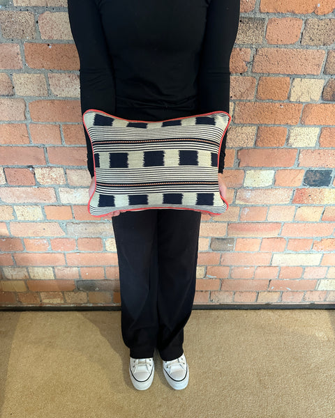 Lumbar cushion in Christopher Farr Lost and found Indigo with red piping