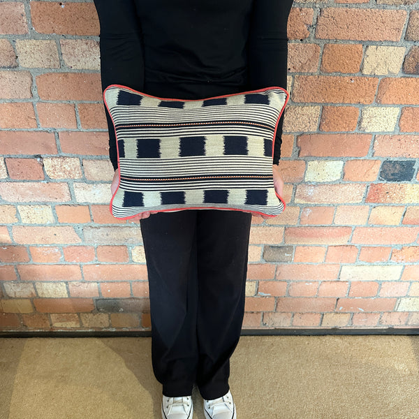 Lumbar cushion in Christopher Farr Lost and found Indigo with red piping