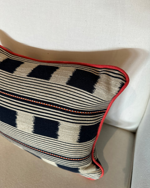 Lumbar cushion in Christopher Farr Lost and found Indigo with red piping