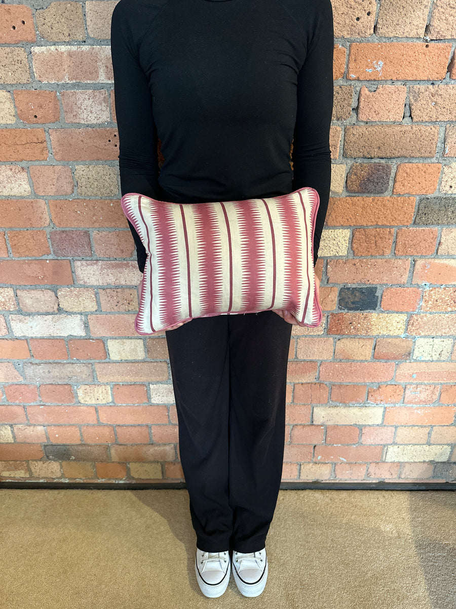 Lumbar cushion in Studio Humbug Squiggle Rhubarb
