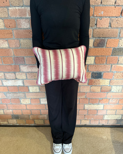 Lumbar cushion in Studio Humbug Squiggle Rhubarb