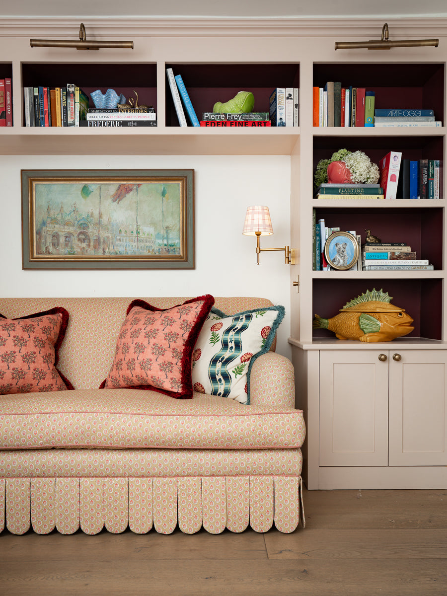 Discover the Sean Symington collection. Traditionally handmade in Derbyshire, featuring rolled-arm frames, contrast piping, and scalloped skirts