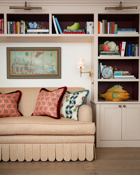 Discover the Sean Symington collection. Traditionally handmade in Derbyshire, featuring rolled-arm frames, contrast piping, and scalloped skirts