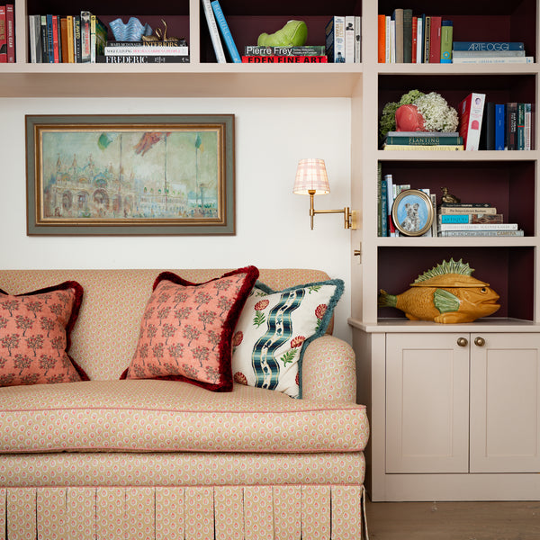 Discover the Sean Symington collection. Traditionally handmade in Derbyshire, featuring rolled-arm frames, contrast piping, and scalloped skirts