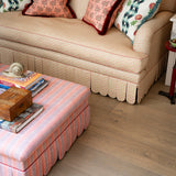 Ottoman and sofa, both scalloped edges, handcut and contrast piping