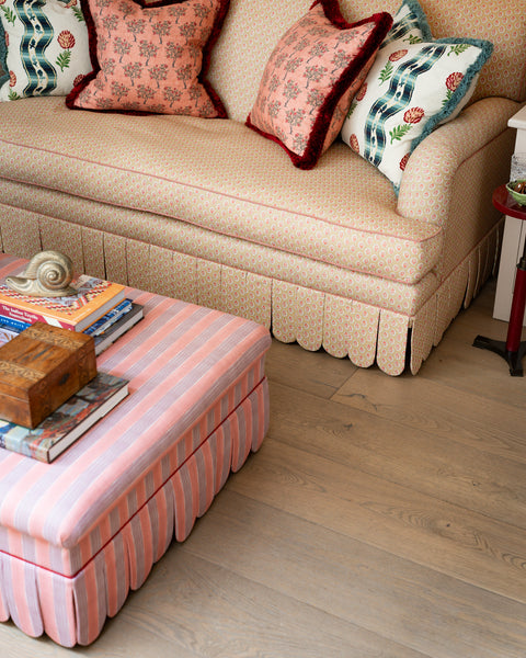 Ottoman and sofa, both scalloped edges, handcut and contrast piping