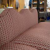 The wavy back of this banquette seating