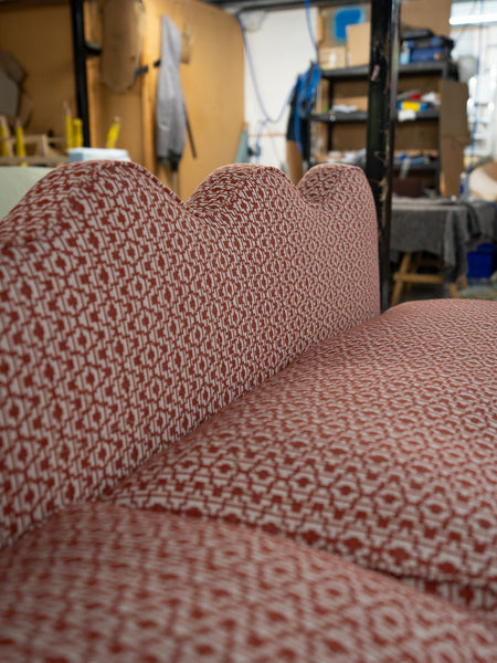 The wavy back of this banquette seating