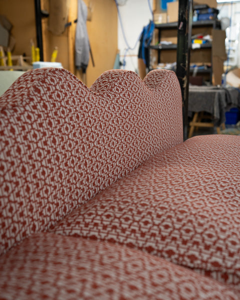 The wavy back of this banquette seating