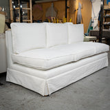 A skirted sofa in white