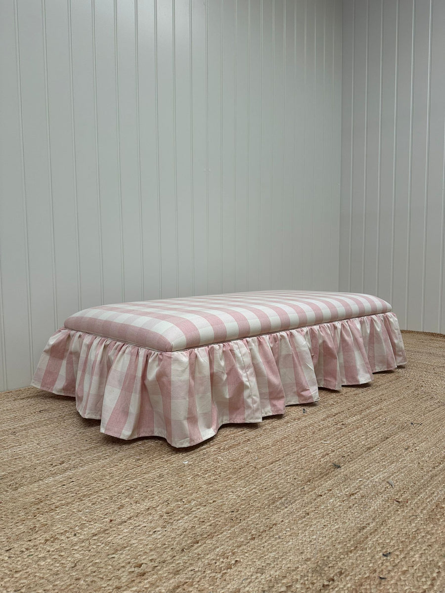 End of bed ottoman, wrapped with skirt