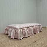 End of bed ottoman, wrapped with skirt