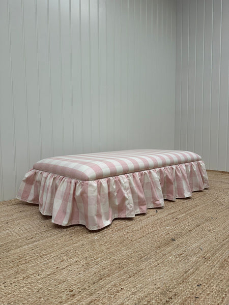 End of bed ottoman, wrapped with skirt