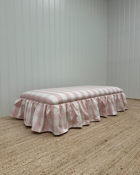 End of bed ottoman, wrapped with skirt