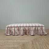 upholstered ottoman wrapped with frill skirt