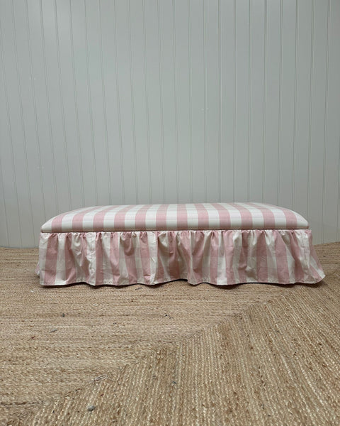 upholstered ottoman wrapped with frill skirt