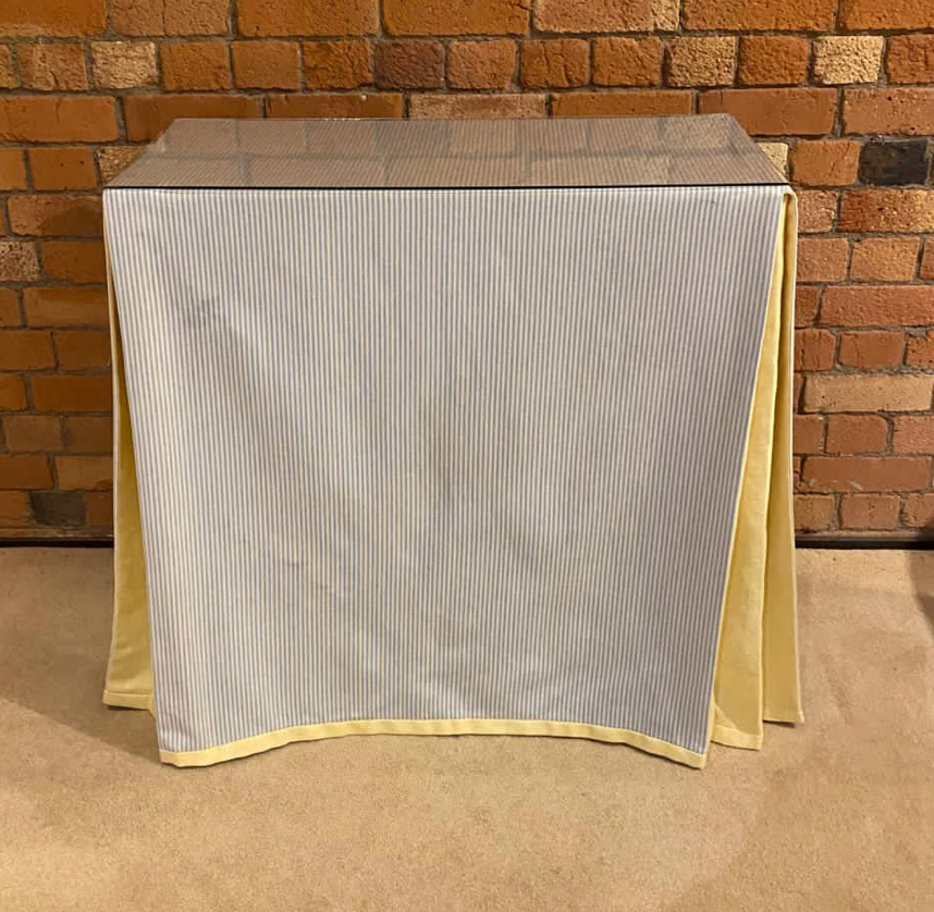 Ruth Table with table cloth and glass top