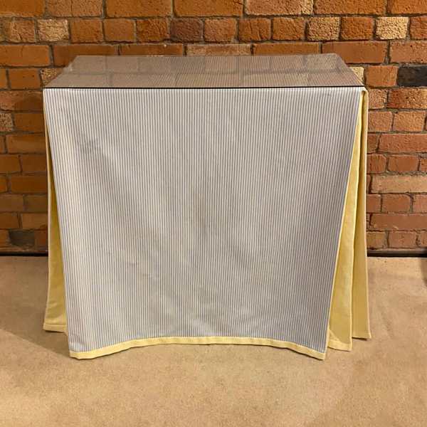 Ruth Table with table cloth and glass top