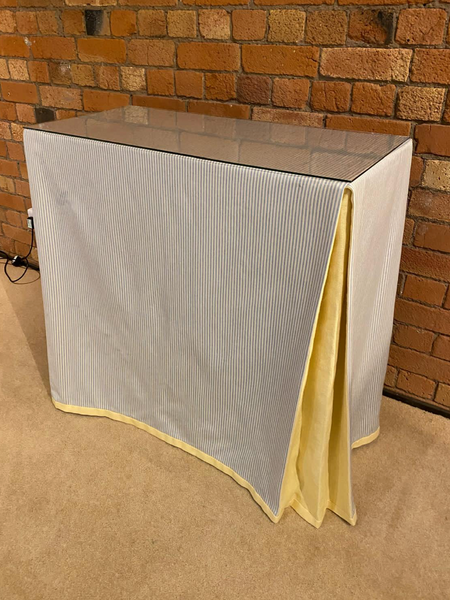 Ruth Table with table cloth and glass top