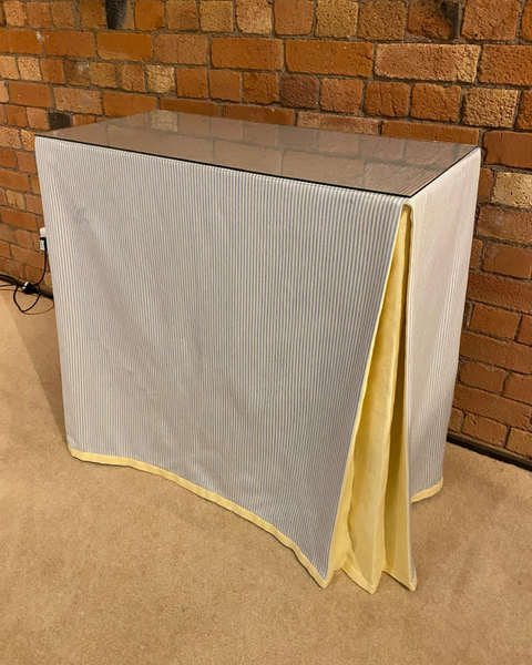 Ruth Table with table cloth and glass top