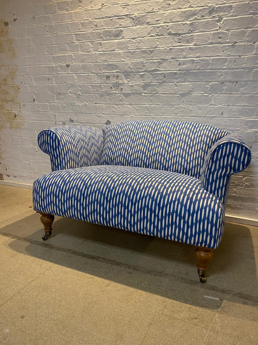 Bespoke loveseat in Linwood Smocked on castor legs