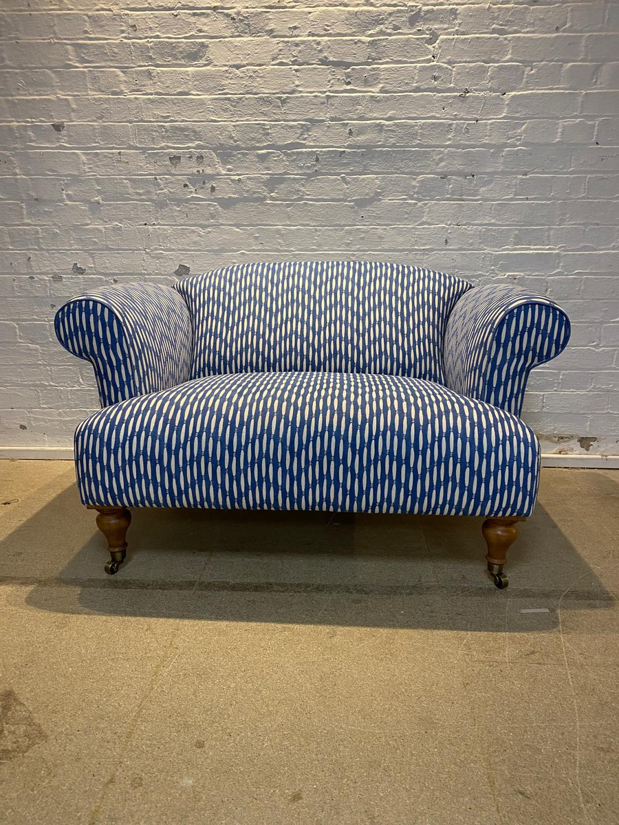 Bespoke loveseat in Linwood Smocked on castor legs
