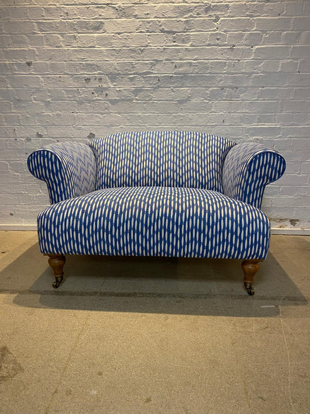 Bespoke loveseat in Linwood Smocked on castor legs