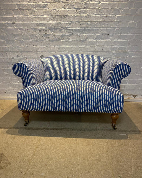 Bespoke loveseat in Linwood Smocked on castor legs